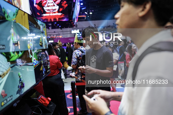 Gamers play video games with the Nintendo Switch at the Thailand Game Show 2024 in Bangkok, Thailand, on October 20, 2024. The Thailand Game...