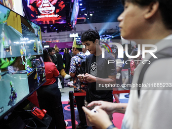 Gamers play video games with the Nintendo Switch at the Thailand Game Show 2024 in Bangkok, Thailand, on October 20, 2024. The Thailand Game...