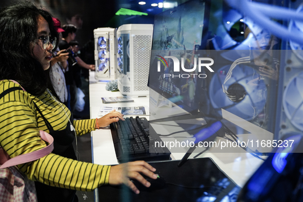 Gamers play video games at the Thailand Game Show 2024 in Bangkok, Thailand, on October 20, 2024. The Thailand Game Show 2024 gaming event t...