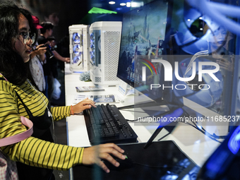 Gamers play video games at the Thailand Game Show 2024 in Bangkok, Thailand, on October 20, 2024. The Thailand Game Show 2024 gaming event t...