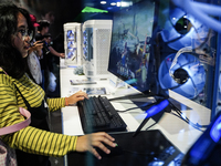 Gamers play video games at the Thailand Game Show 2024 in Bangkok, Thailand, on October 20, 2024. The Thailand Game Show 2024 gaming event t...