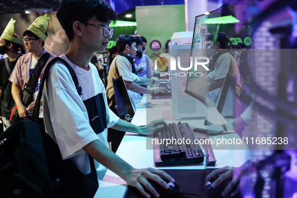 Gamers play video games at the Thailand Game Show 2024 in Bangkok, Thailand, on October 20, 2024. The Thailand Game Show 2024 gaming event t...