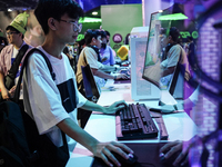 Gamers play video games at the Thailand Game Show 2024 in Bangkok, Thailand, on October 20, 2024. The Thailand Game Show 2024 gaming event t...