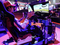 Gamers play video games at the Thailand Game Show 2024 in Bangkok, Thailand, on October 20, 2024. The Thailand Game Show 2024 gaming event t...