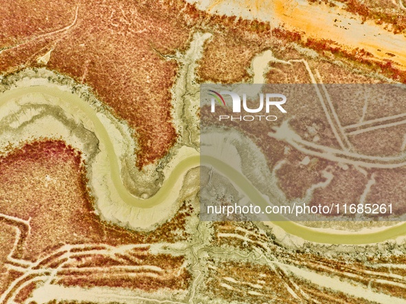 A photo taken on October 20, 2024, shows various patterns left on the beach after the ebb tide at the Yanghe Estuary wetland in Jiaozhou Bay...