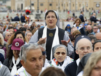 A nun prays during the Holy Mass and canonization of 14 saints and martyrs from Damascus, at Saint Peter's Square in the Vatican, on October...