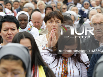 A pilgrim attends the Holy Mass and canonization of 14 saints and martyrs from Damascus at Saint Peter's Square in the Vatican on October 20...