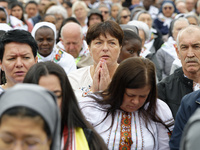 A pilgrim attends the Holy Mass and canonization of 14 saints and martyrs from Damascus at Saint Peter's Square in the Vatican on October 20...