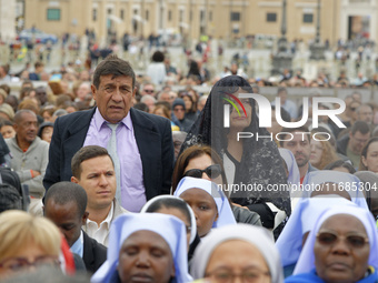 A pilgrim attends the Holy Mass and canonization of 14 saints and martyrs from Damascus at Saint Peter's Square in the Vatican on October 20...