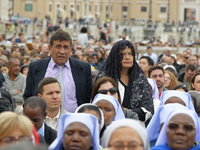 A pilgrim attends the Holy Mass and canonization of 14 saints and martyrs from Damascus at Saint Peter's Square in the Vatican on October 20...