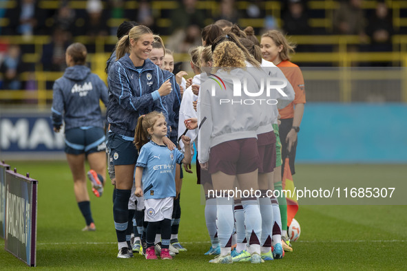 Teams shake hands during the Barclays FA Women's Super League match between Manchester City and Aston Villa at the Joie Stadium in Mancheste...