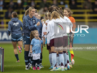 Teams shake hands during the Barclays FA Women's Super League match between Manchester City and Aston Villa at the Joie Stadium in Mancheste...