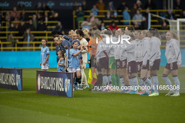 Teams shake hands during the Barclays FA Women's Super League match between Manchester City and Aston Villa at the Joie Stadium in Mancheste...