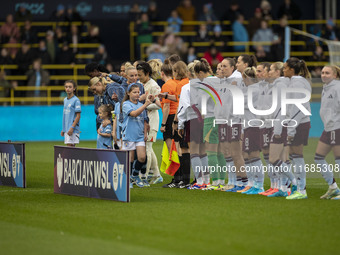 Teams shake hands during the Barclays FA Women's Super League match between Manchester City and Aston Villa at the Joie Stadium in Mancheste...