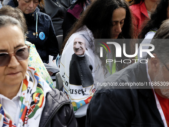 A pilgrim wears a T-shirt with the face of Giuseppe Allamano, founder of the Consolata Missionaries, during Pope Francis's Holy Mass and the...