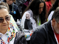 A pilgrim wears a T-shirt with the face of Giuseppe Allamano, founder of the Consolata Missionaries, during Pope Francis's Holy Mass and the...