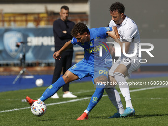 Empoli's Sebastiano Esposito and Napoli's Amir Rrahmani participate in the Serie A soccer match between Empoli FC and SSC Napoli at Stadio C...