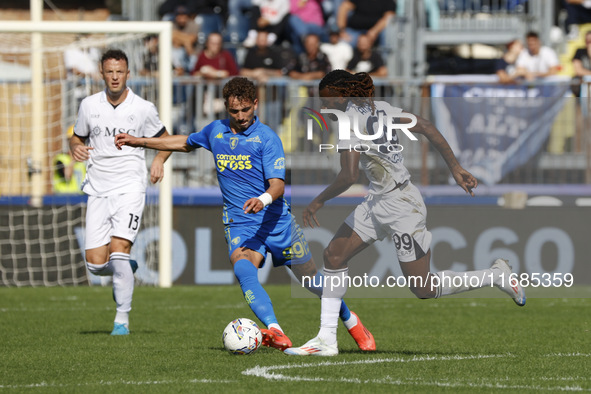 Napoli's Frank Zambo Anguissa and Empoli's Sebastiano Esposito play during the Serie A soccer match between Empoli FC and SSC Napoli at Stad...