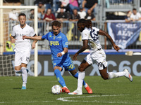 Napoli's Frank Zambo Anguissa and Empoli's Sebastiano Esposito play during the Serie A soccer match between Empoli FC and SSC Napoli at Stad...