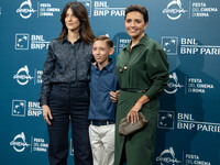 Barbara Ronchi, Christian Cervone, and Serena Rossi attend the ''Il Treno Dei Bambini'' photocall during the 19th Rome Film Festival at Audi...