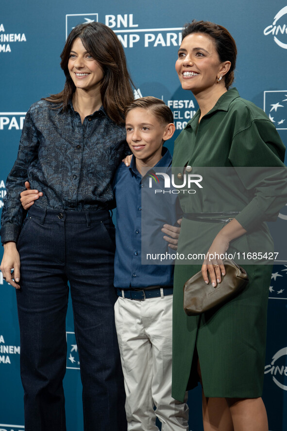 Barbara Ronchi, Christian Cervone, and Serena Rossi attend the ''Il Treno Dei Bambini'' photocall during the 19th Rome Film Festival at Audi...