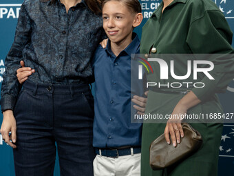 Barbara Ronchi, Christian Cervone, and Serena Rossi attend the ''Il Treno Dei Bambini'' photocall during the 19th Rome Film Festival at Audi...