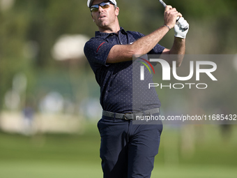 In San Roque, Spain, on October 12, 2024, Julien Guerrier of France plays his second shot on the 2nd hole on the fourth day of the Estrella...