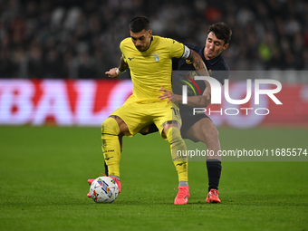 Mattia Zaccagni of SS Lazio and Andrea Cambiaso of Juventus FC battle for the ball during the Juventus FC vs. SS Lazio match, the 8th round...