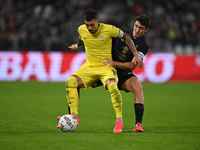 Mattia Zaccagni of SS Lazio and Andrea Cambiaso of Juventus FC battle for the ball during the Juventus FC vs. SS Lazio match, the 8th round...