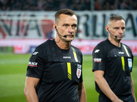 Referee Jaroslaw Przybyl officiates the game between KS Cracovia and Lech Poznan in Krakow, Poland, on October 19, 2024, during the PKO BP E...