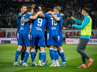 Lech Poznan players celebrate scoring a goal during the game between KS Cracovia and Lech Poznan in Krakow, Poland, on October 19, 2024, in...