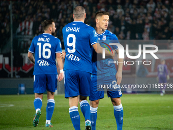 Lech Poznan players celebrate scoring a goal during the game between KS Cracovia and Lech Poznan in Krakow, Poland, on October 19, 2024, in...