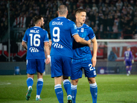 Lech Poznan players celebrate scoring a goal during the game between KS Cracovia and Lech Poznan in Krakow, Poland, on October 19, 2024, in...