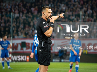 Referee Jaroslaw Przybyl officiates the game between KS Cracovia and Lech Poznan in Krakow, Poland, on October 19, 2024, during the PKO BP E...