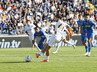 Napoli's Khvicha Kvaratskhelia scores their first goal on a penalty during the Serie A soccer match between Empoli FC and SSC Napoli at Stad...