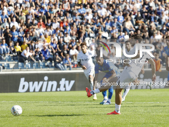 Napoli's Khvicha Kvaratskhelia scores their first goal on a penalty during the Serie A soccer match between Empoli FC and SSC Napoli at Stad...