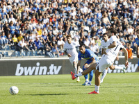 Napoli's Khvicha Kvaratskhelia scores their first goal on a penalty during the Serie A soccer match between Empoli FC and SSC Napoli at Stad...