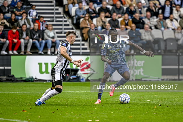 An AFC Ajax Amsterdam player participates in the match between Heracles Almelo and Ajax at the Asito Stadium for the Dutch Eredivisie season...