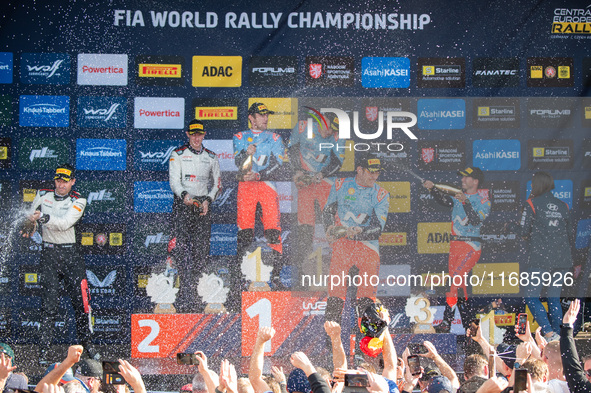 Elfyn Evans (Gbr), Scott Martin (Gbr), Ott Tanak (Est), Martin Jarveoja (Est), Thierry Neuville (Bel), and Martijn Wydaeghe (Bel) celebrate...