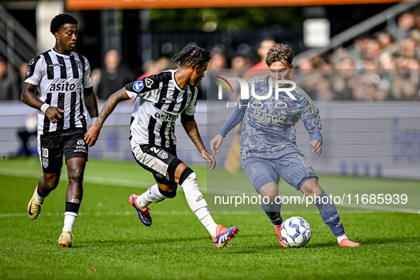 Heracles Almelo defender Mimeirhel Benita and AFC Ajax Amsterdam forward Mika Godts are present during the match between Heracles Almelo and...