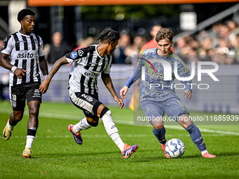 Heracles Almelo defender Mimeirhel Benita and AFC Ajax Amsterdam forward Mika Godts are present during the match between Heracles Almelo and...