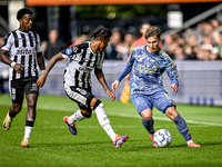 Heracles Almelo defender Mimeirhel Benita and AFC Ajax Amsterdam forward Mika Godts are present during the match between Heracles Almelo and...