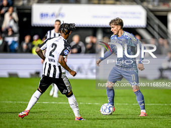 AFC Ajax Amsterdam forward Mika Godts plays during the match between Heracles Almelo and Ajax at the Asito Stadium for the Dutch Eredivisie...