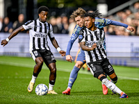 Heracles Almelo midfielder Siloh t Zand, AFC Ajax Amsterdam forward Mika Godts, and Heracles Almelo defender Mimeirhel Benita participate in...