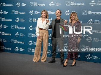 Claudia Gerini, Rocco Papaleo, and Michela Andreozzi attend the ''100 Di Questi Anni'' photocall during the 19th Rome Film Festival at Audit...