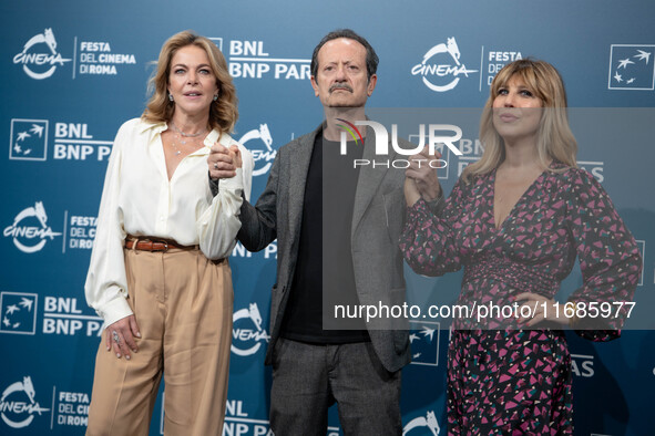 Claudia Gerini, Rocco Papaleo, and Michela Andreozzi attend the ''100 Di Questi Anni'' photocall during the 19th Rome Film Festival at Audit...