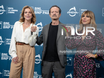 Claudia Gerini, Rocco Papaleo, and Michela Andreozzi attend the ''100 Di Questi Anni'' photocall during the 19th Rome Film Festival at Audit...