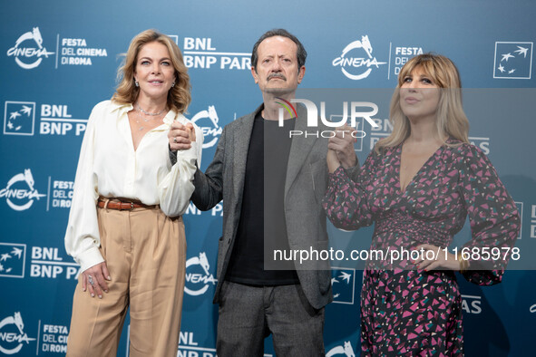 Claudia Gerini, Rocco Papaleo, and Michela Andreozzi attend the ''100 Di Questi Anni'' photocall during the 19th Rome Film Festival at Audit...