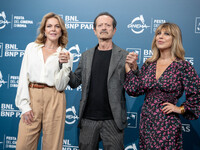 Claudia Gerini, Rocco Papaleo, and Michela Andreozzi attend the ''100 Di Questi Anni'' photocall during the 19th Rome Film Festival at Audit...