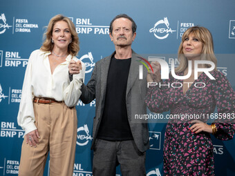 Claudia Gerini, Rocco Papaleo, and Michela Andreozzi attend the ''100 Di Questi Anni'' photocall during the 19th Rome Film Festival at Audit...